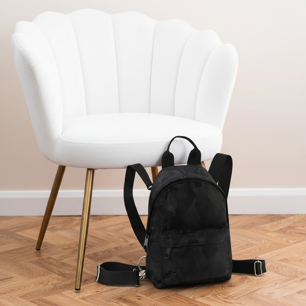 Camo Mini Backpack next to white velvet chair