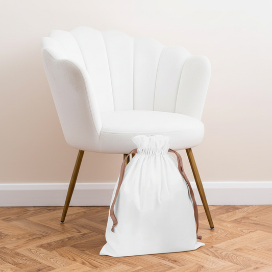 Cotton Bag with Draw String next to white velvet chair