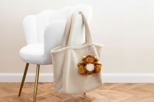 Cream Fleece Shopper with Highland Cow Keyring on White Chair