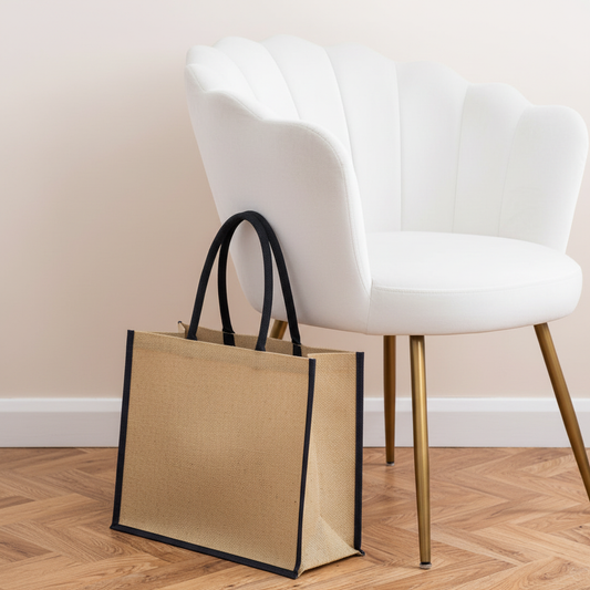 Jute Classic Shopper (natural/blue) next to white velvet chair