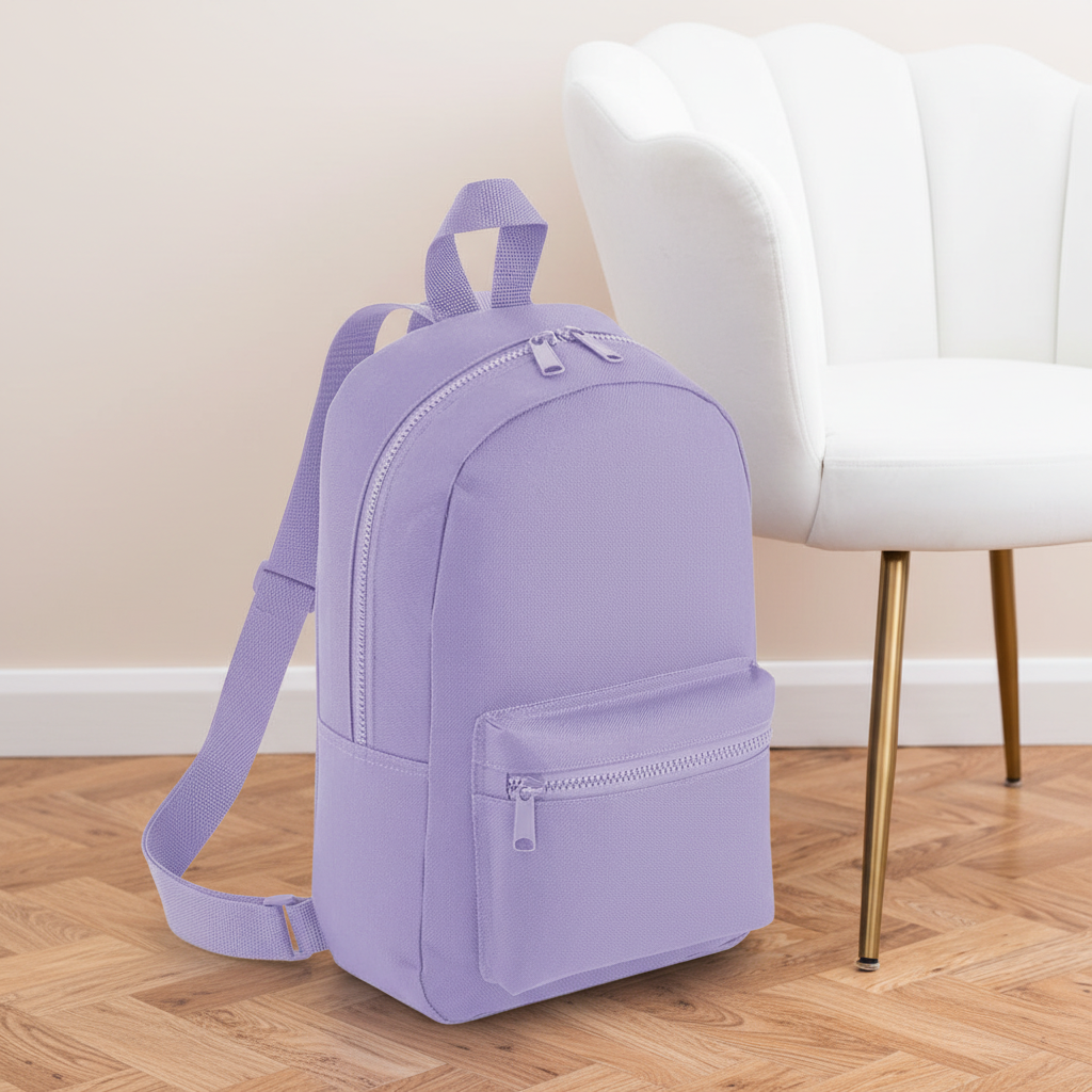 Mini Essential Bagbase Backpack (lavender) with aesthetic background