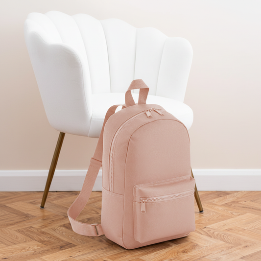 Mini Essential Bagbase Backpack (peach) with aesthetic background