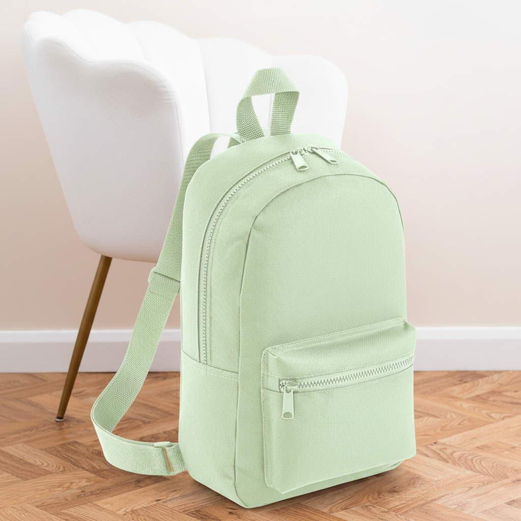 Mini Essential Bagbase Backpack (pistachio) with aesthetic background