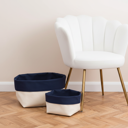 Reversible Canvas Organiser (blue) next to white velvet chair